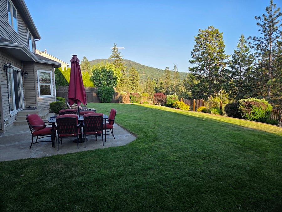 Patio furniture to enjoy the large fenced yard and views.