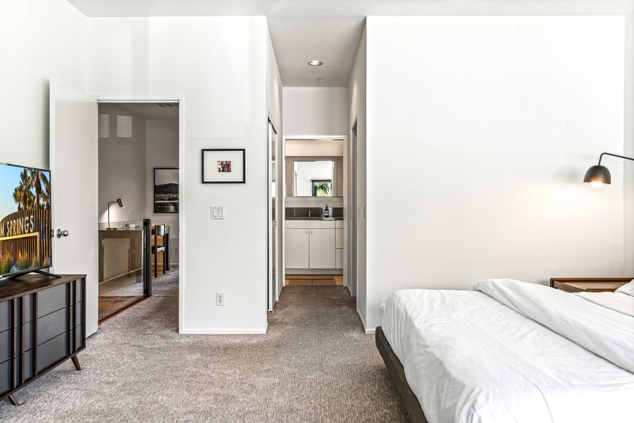 Primary king en-suite bedroom with view to hallway