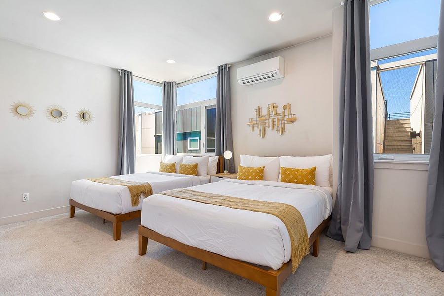 2 queen beds in master bedroom, ideal for families taking care of little ones