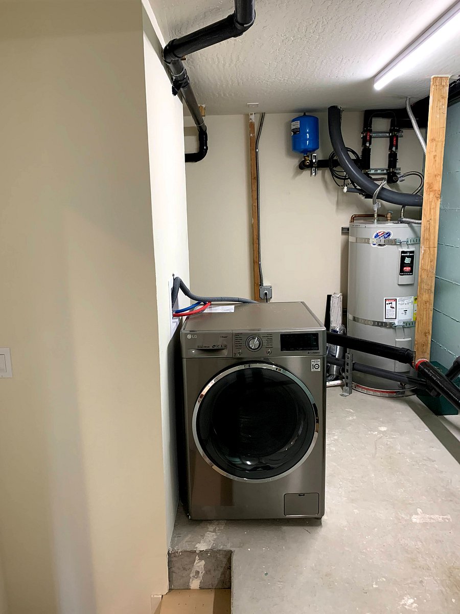 Extra area at back of unit - washer/dryer combo + water heater