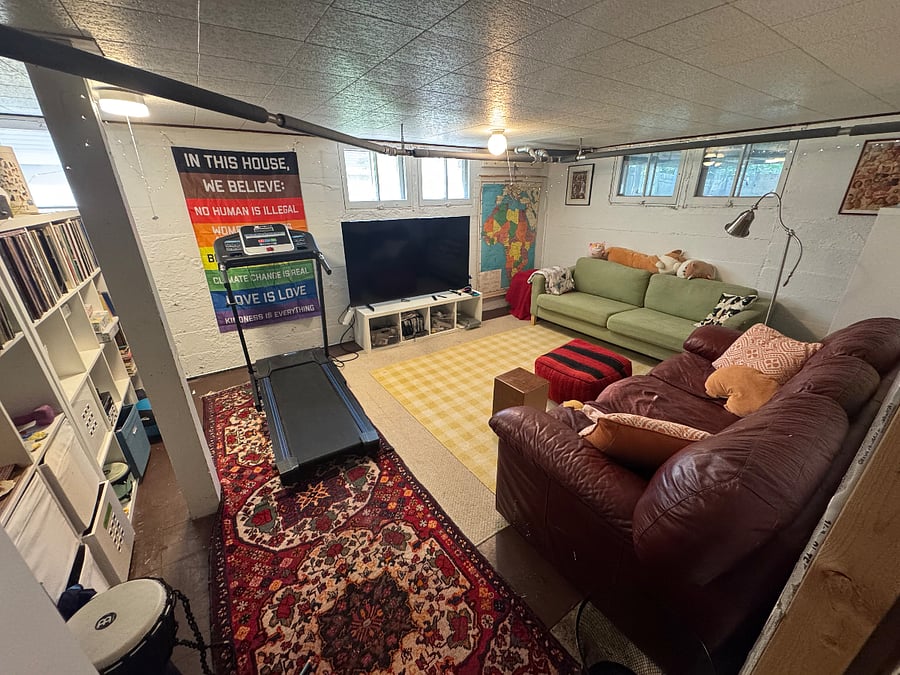Bonus room in the basement with smart TV and treadmill.