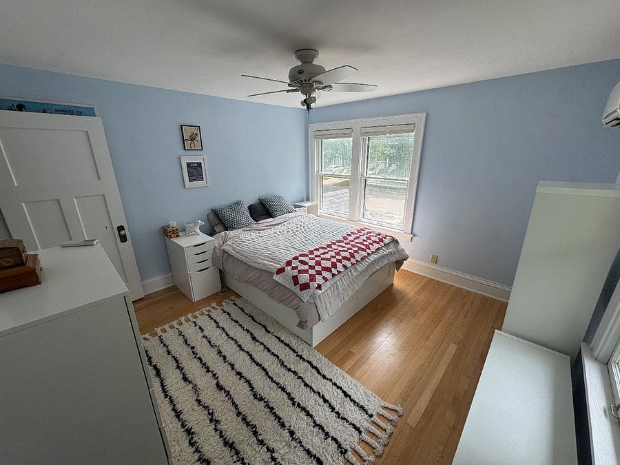 Second-floor bedroom with queen-sized bed.