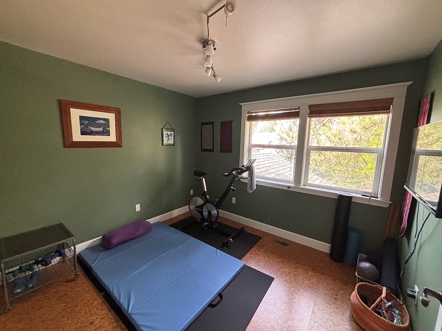 Exercise/yoga room with spin bike