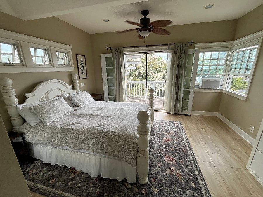 Master Bedroom. Private deck just through the french doors leads up to Rooftop Deck.