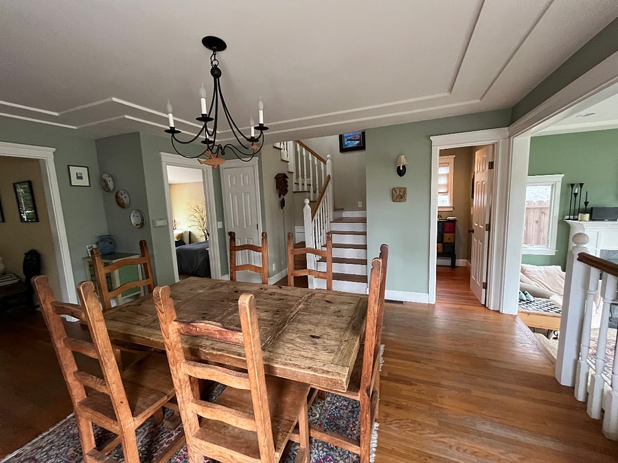 Dining room showing stairs that lead up to the Master Bedroom and Rooftop Deck.