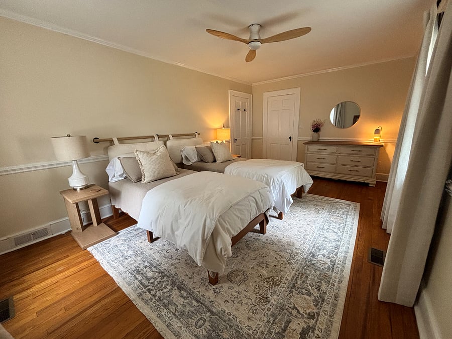 Primary bedroom 2 with king bed, closet, dresser, full length mirror, premium bedding, blackout curtains.