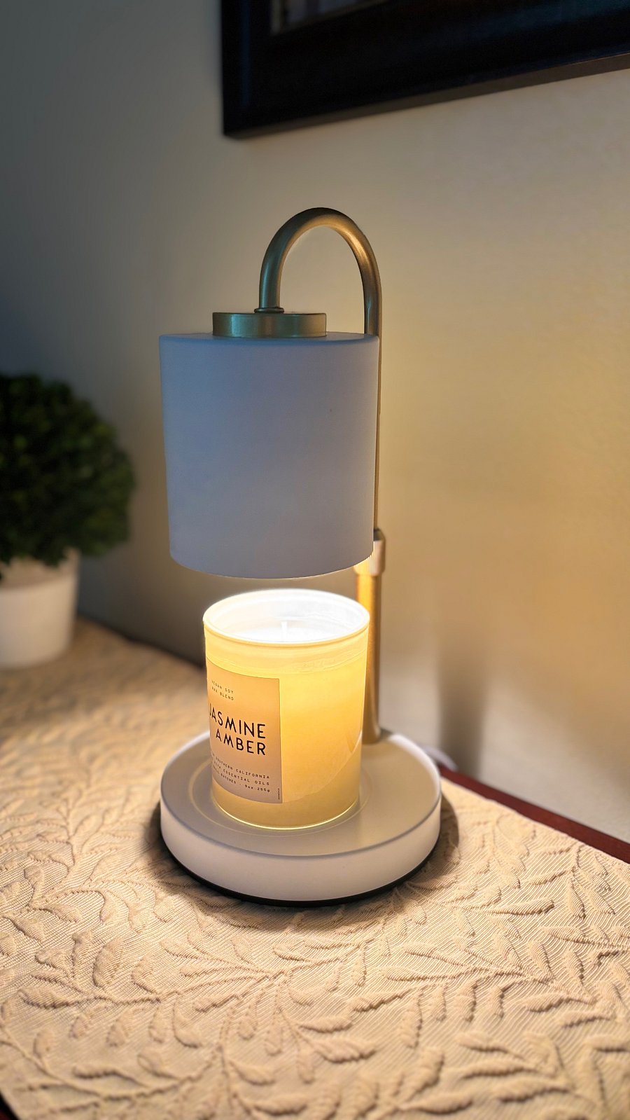 Candle and candle warmer in the living room and two primary bedrooms.