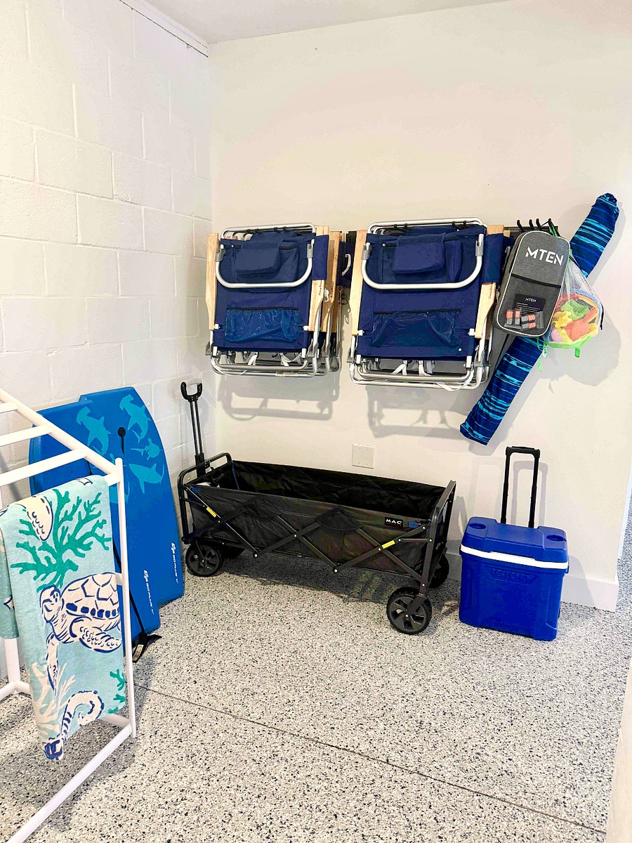Beach supplies included: beach chairs, umbrella, wagon, pickle ball set, cooler with wheels
