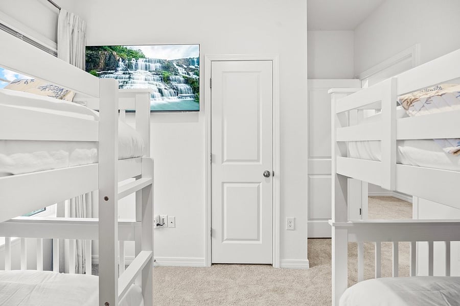Bunk room has a 50" smart tv, black out curtains, and views of the nature preserve