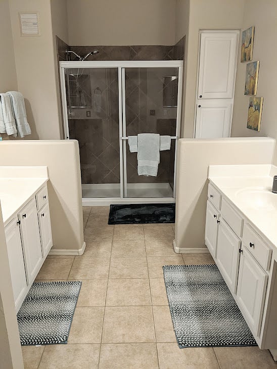 Master ensuite bathroom with 2 sinks.