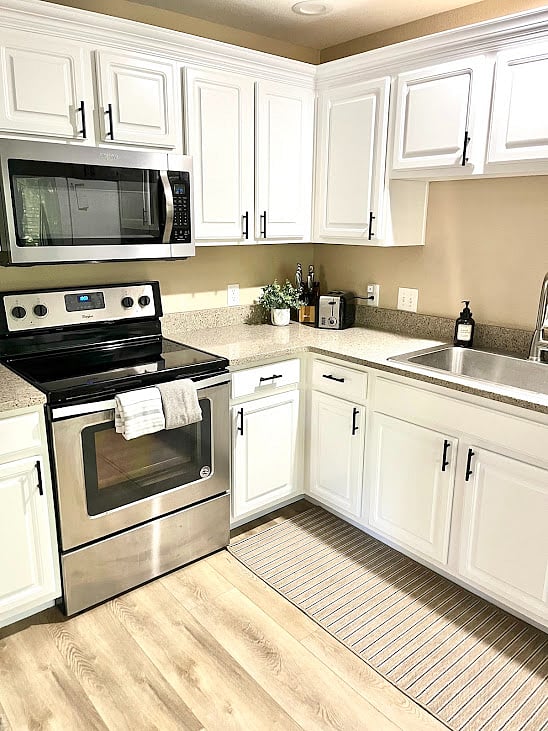 Fully equipped kitchen with new flooring.