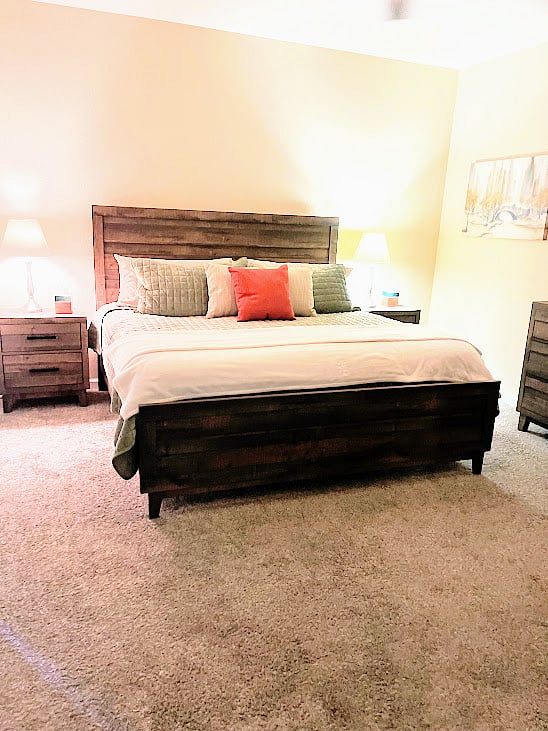 large master bedroom with a king bed.