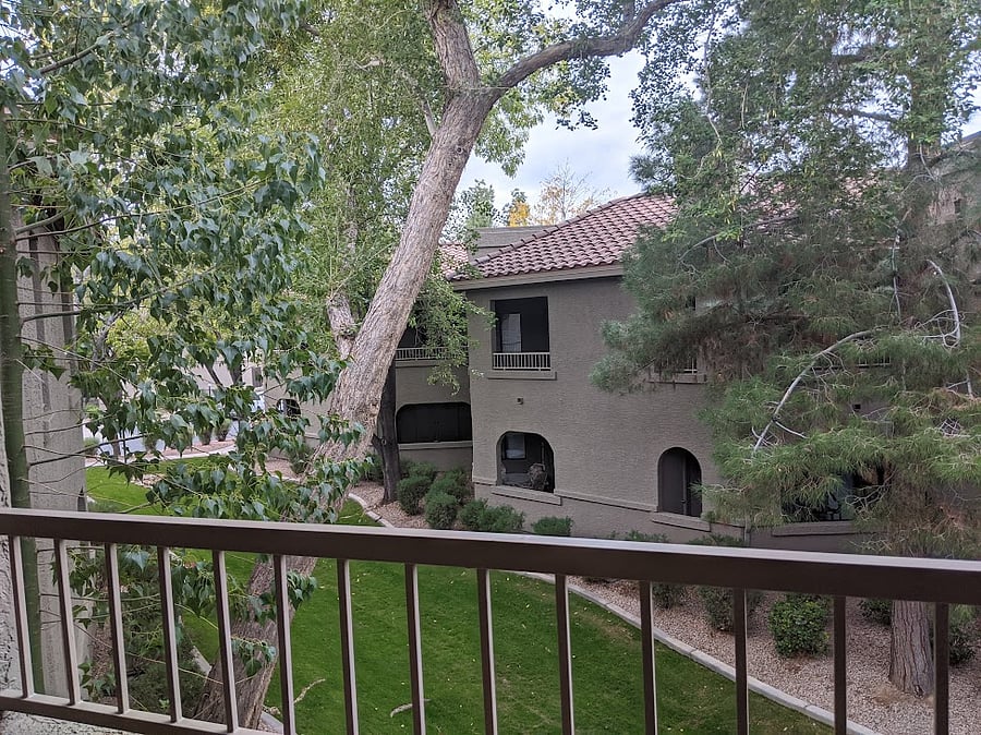 2 covered photos that overlook greenbelts in the community.
