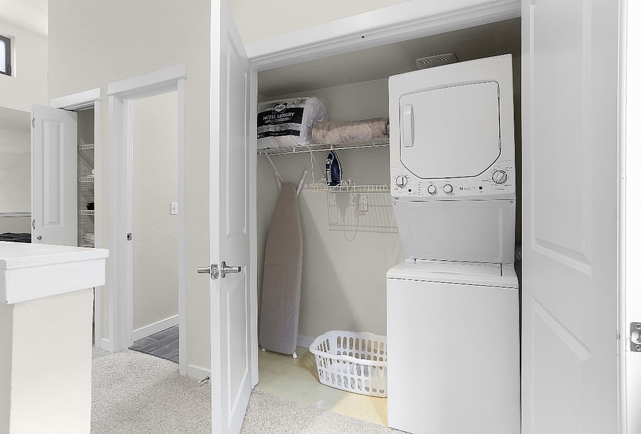 Washer, dryer, extra pillows, blanket, iron and ironing board
