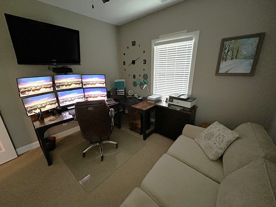 PRIVATE EXECUTIVE WORKSPACE: Space meets performance. Work seamlessly with dual universal docking stations and six 24-inch screens, then unwind on the plush sofa. Perfect for remote tech workers or consultants needing a high-powered home office.