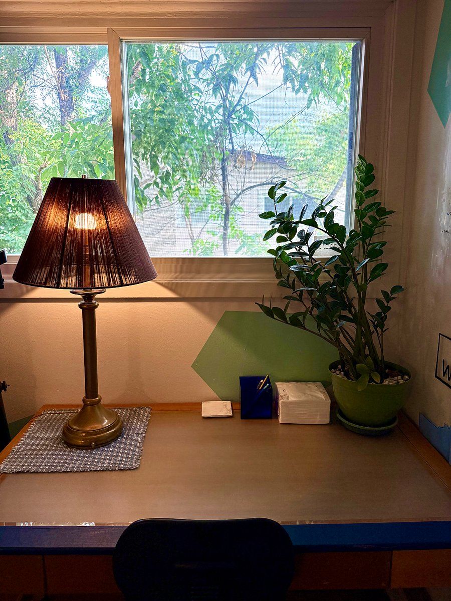 Desk and lamp with window view