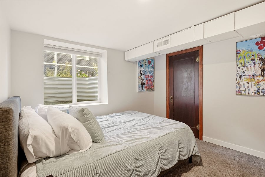 Downstairs bedroom with queen bed