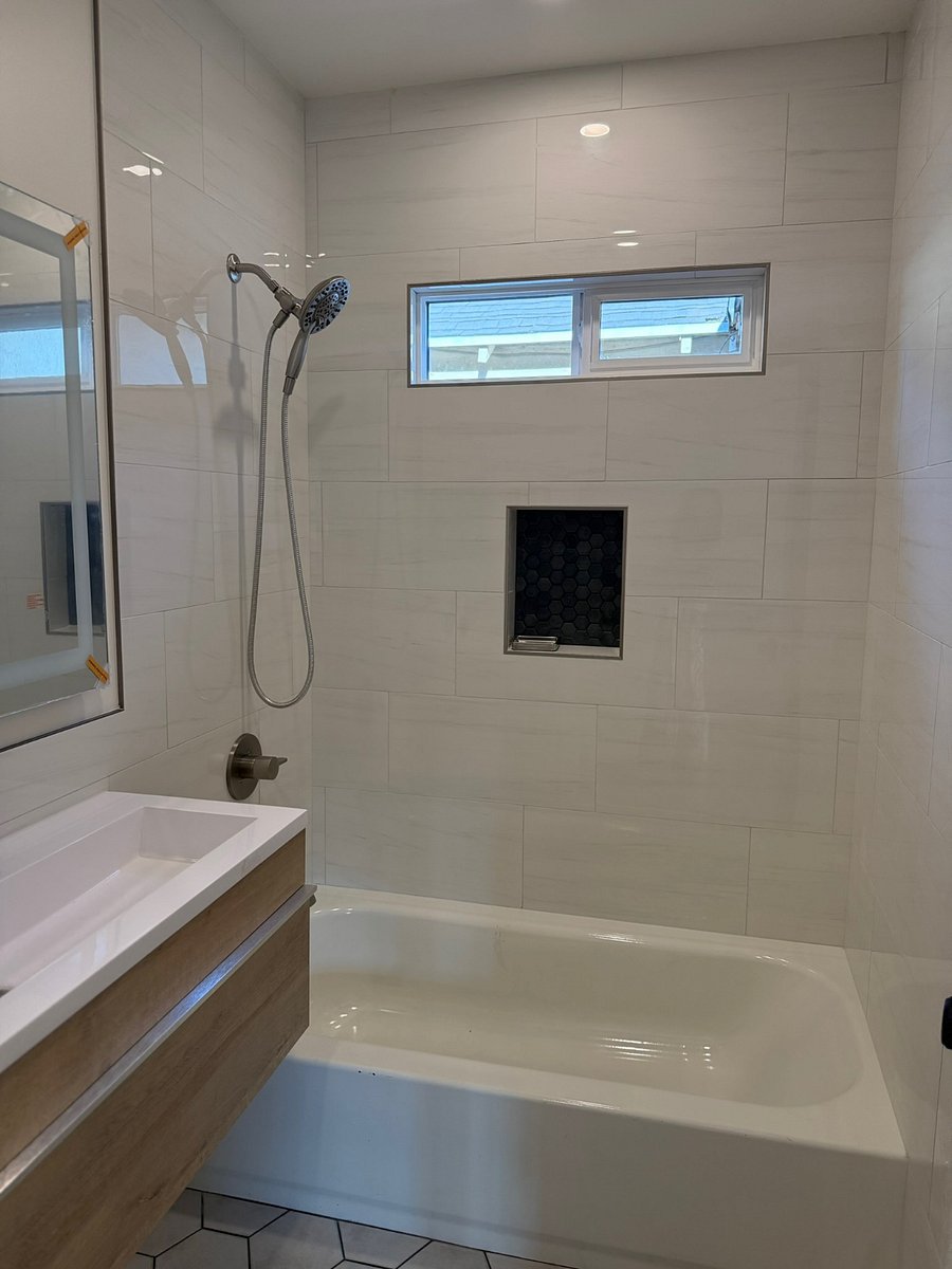 Modern bathroom with all new tile and fixtures.