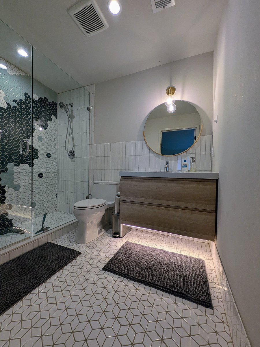 Large vanity with countertop space and room for toiletry storage. Hair dryer in top drawer.
