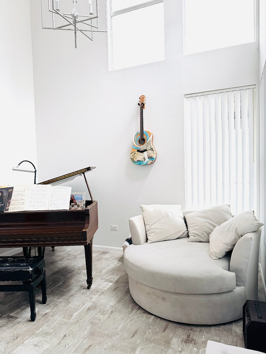 Living Room Features a baby grand piano.