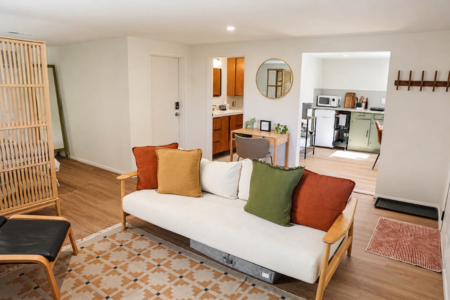 Comfortable seating area with a sofa that easily converts to a bed.