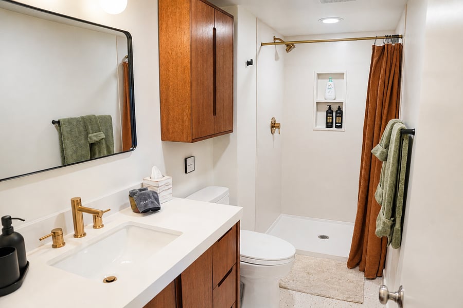 Modern bathroom with walk-in shower and fresh finishes.