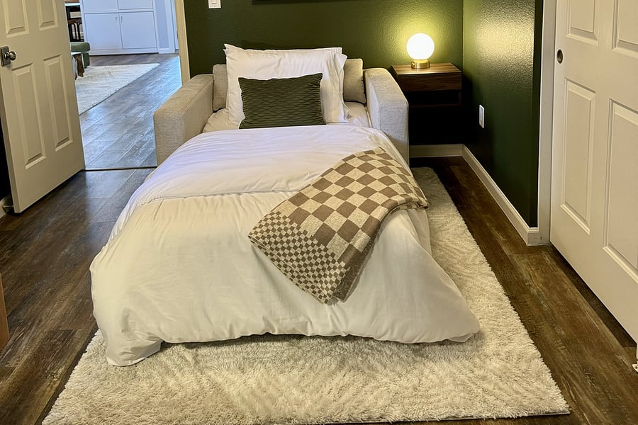 Chair folds out to XL Twin Bed, extra bedding here