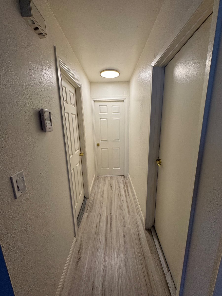 The small bedroom is on the left and the master bedroom is on the right. A separate hallway door divides these two bedrooms from the other two bedrooms, creating a private bedroom suite area and providing excellent privacy from the rest of the house.