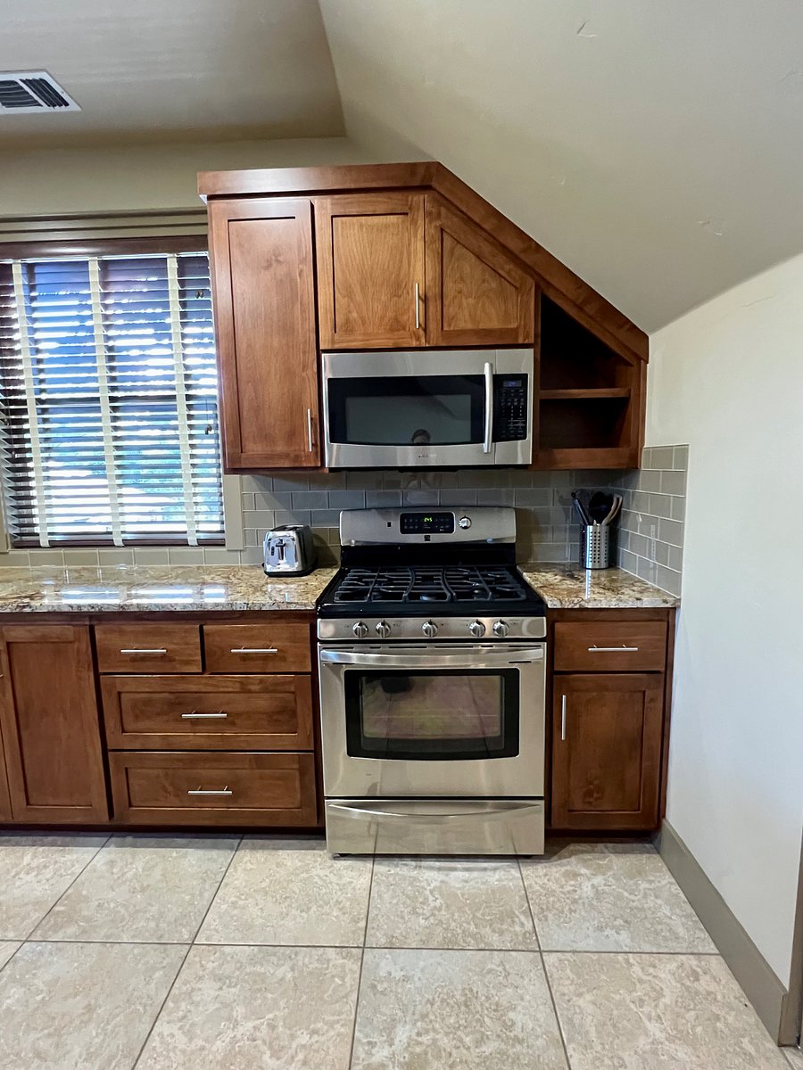 Kitchen with microwave and gas burners and oven