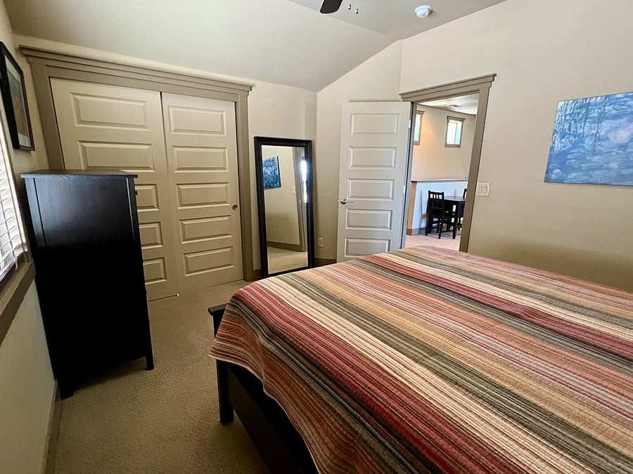 Bedroom with dresser and closet