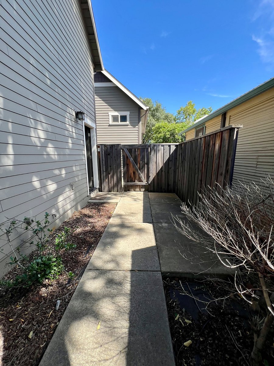 Gated, partially fenced courtyard