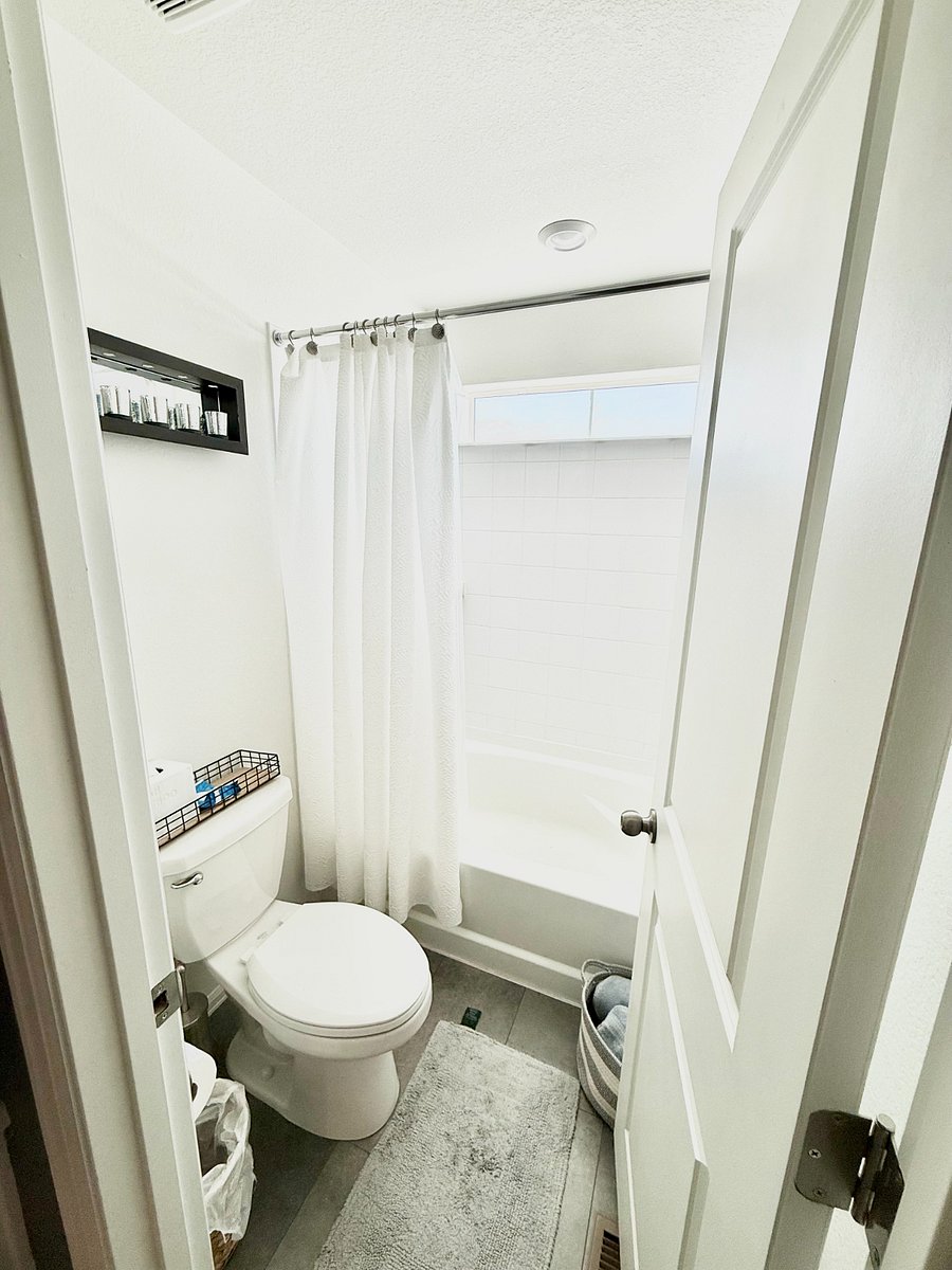 Secondary Bathroom: Private toilet and bathing area featuring a bath/shower.