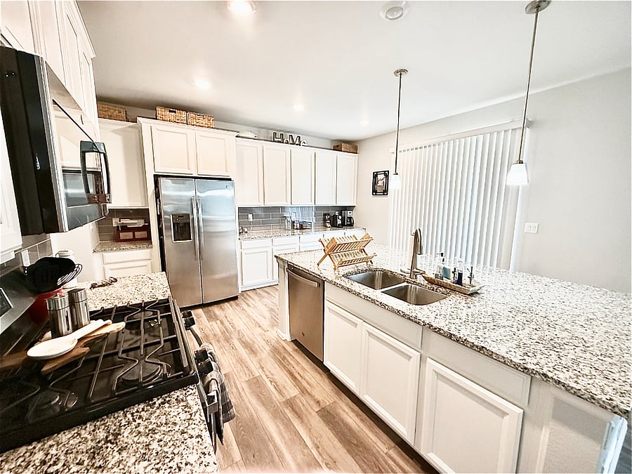 Kitchen: Full fridge, dishwasher, island & coffee bar.