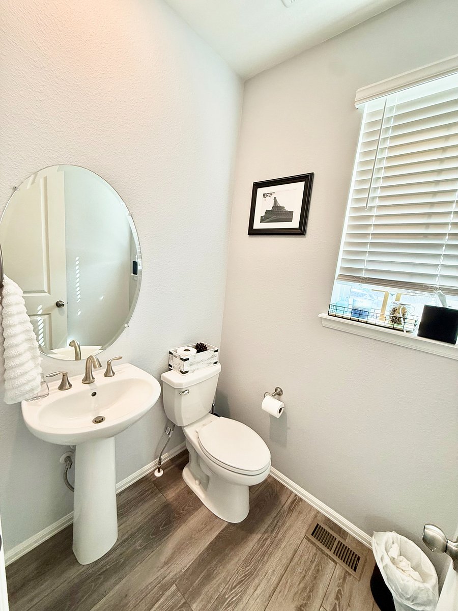 Powder room: Guest half-bath room next to coat closet.