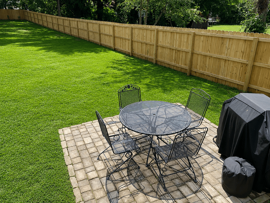 Back patio includes 4 person table, grill and solo stove