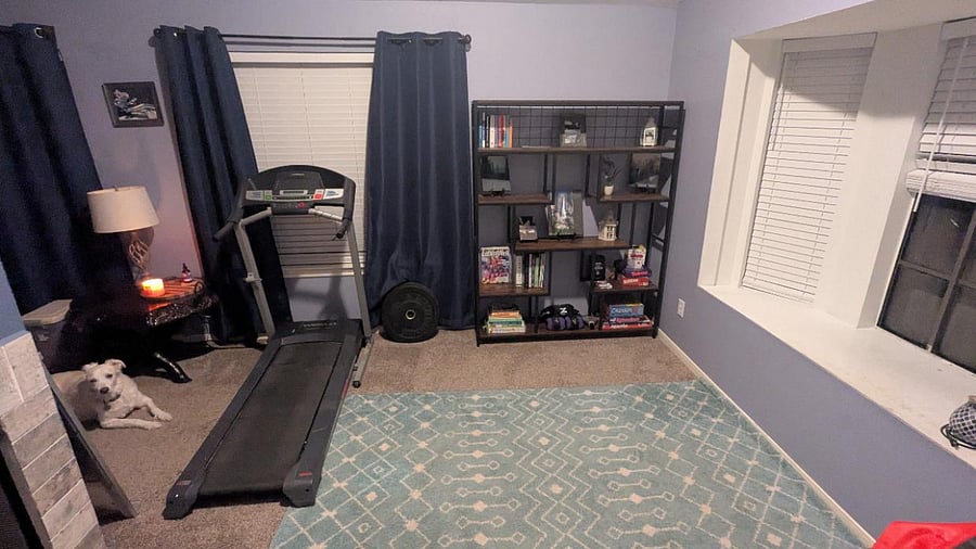 Front living area- has treadmill, cookbooks, and board games