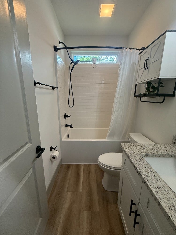 Suite # 1 full bathroom with tub and shower 