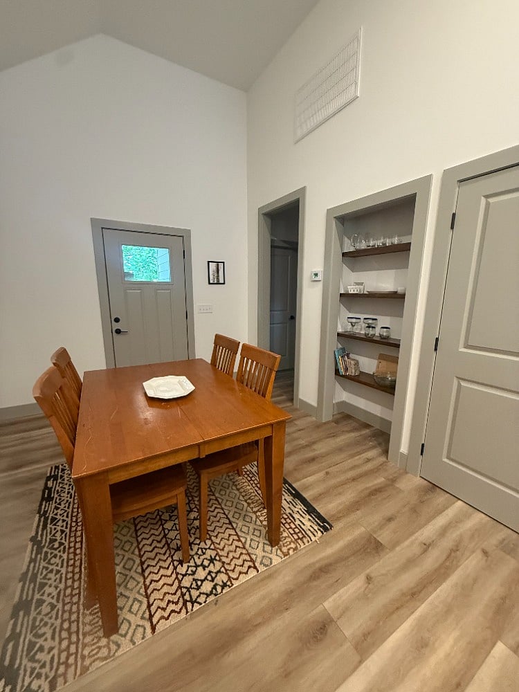Glassware and serving pieces in these built in shelves. 