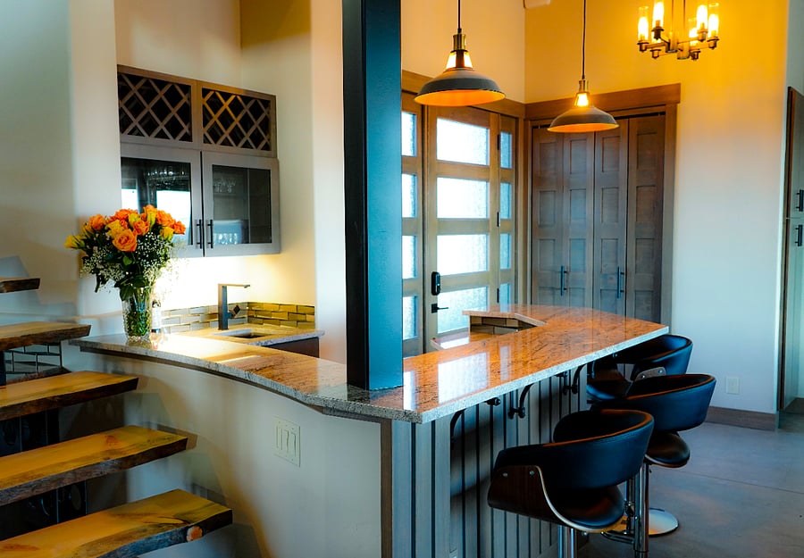 Bar is complete with refrigerator and sink.