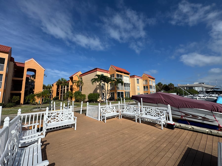 Beautiful community waterfront deck with seating - perfect for morning coffee or watching the sunset.