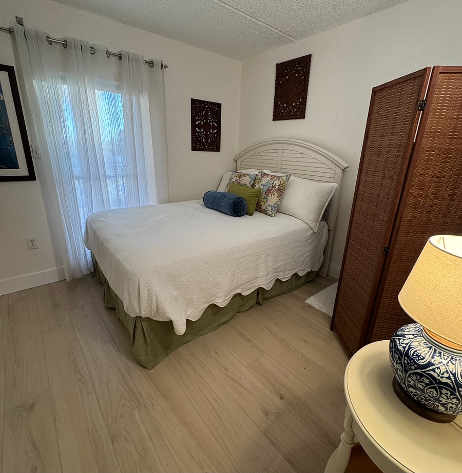 Comfortable second bedroom featuring a queen bed.