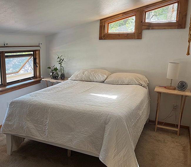 Full-size bed with memory foam topper, very comfy!