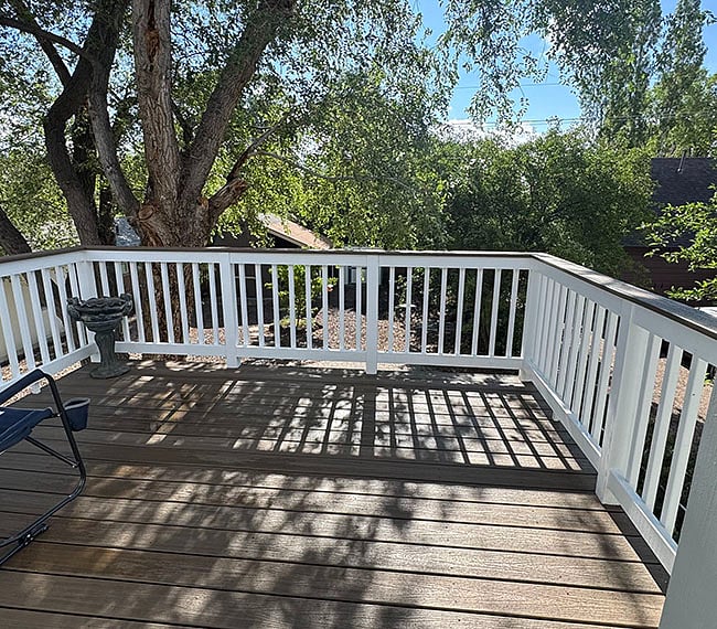 The spacious, private deck faces east. Includes a bistro table and 2 camp-style chairs (not shown)