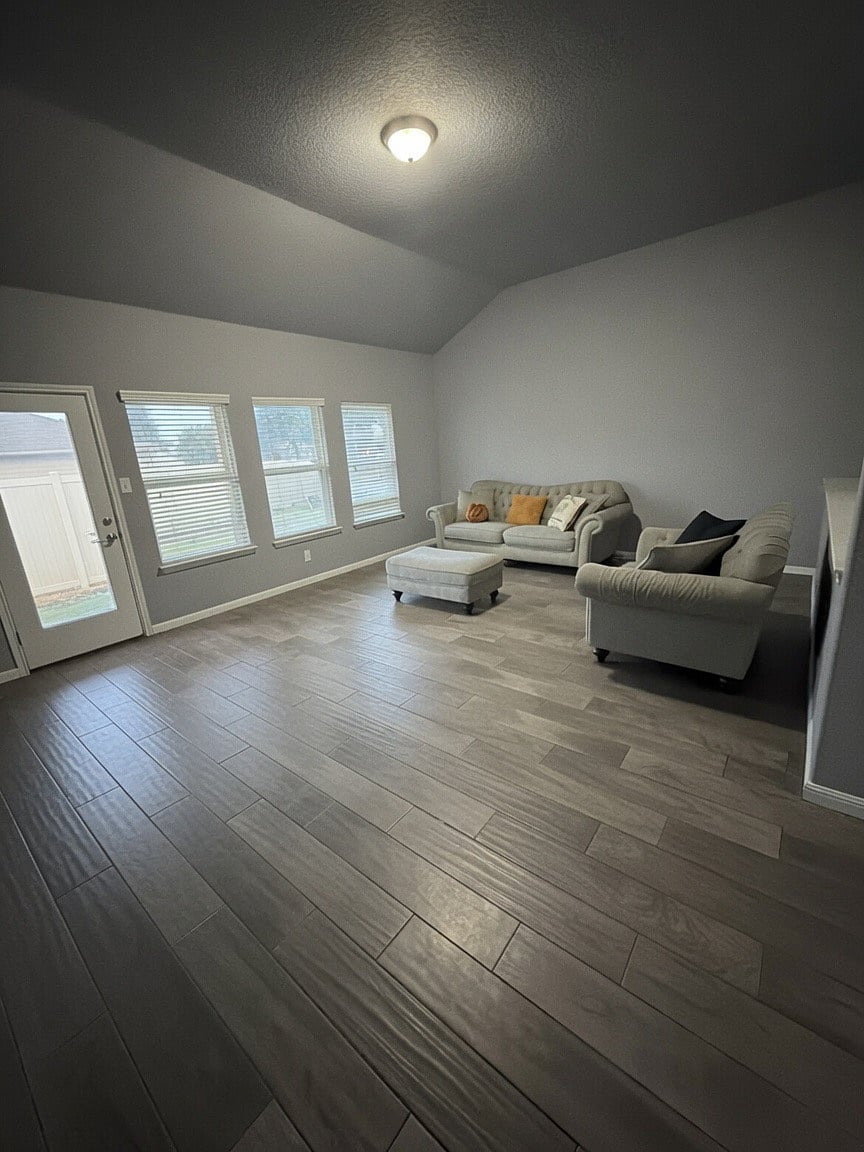 Living room by open concept kitchen