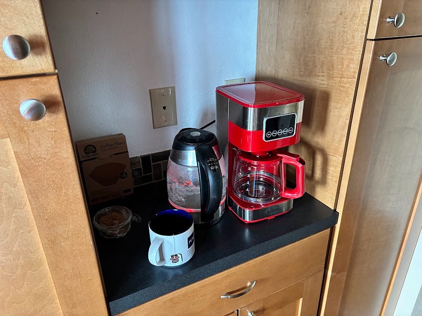 Coffee maker and tea kettle. Coffee and tea makings provided. 