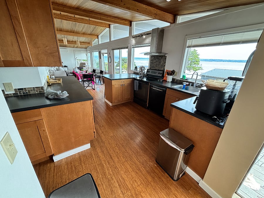 Cabinets with full dishware and silverware, pots and pans, cooking tools, containers, spices, etc.   