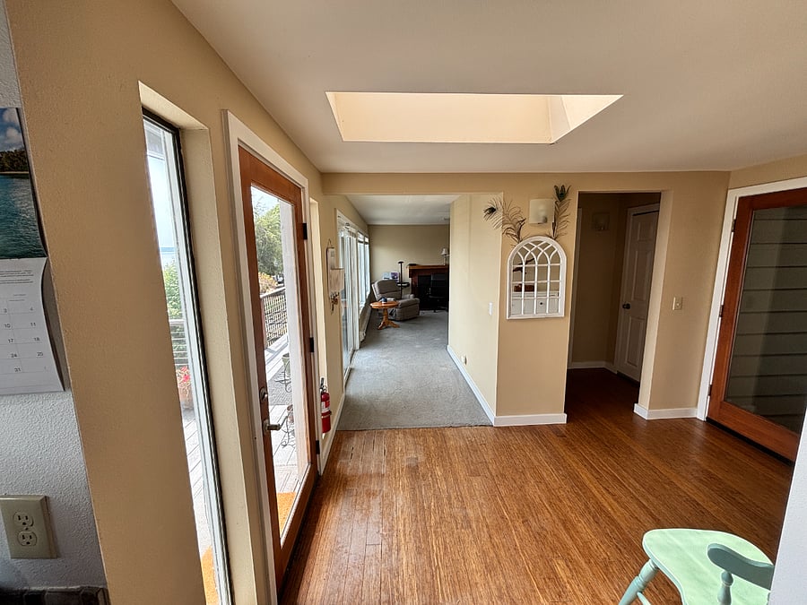 Main entry.  In the back is the rec room.  Kitchen and living room is behind the photographer. 