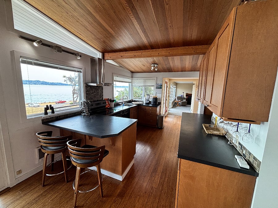Kitchen with two counter height seats, and of course the view windows.  Wineglasses on the right side, and two full counters for cooking. 