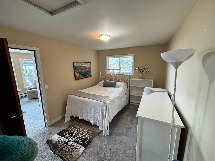 Bedroom off of rec room, with full size bed and closet.,