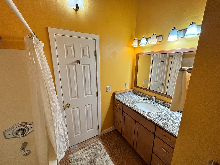 En suite master bath, with tub and shower. 